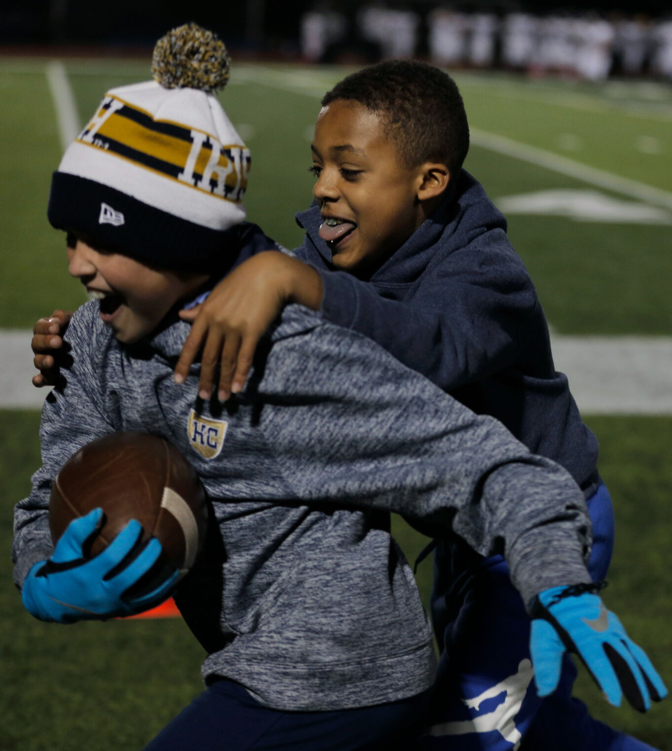 Brenden Ralston, 9, and Keegan Bell, 10, play their own game of football